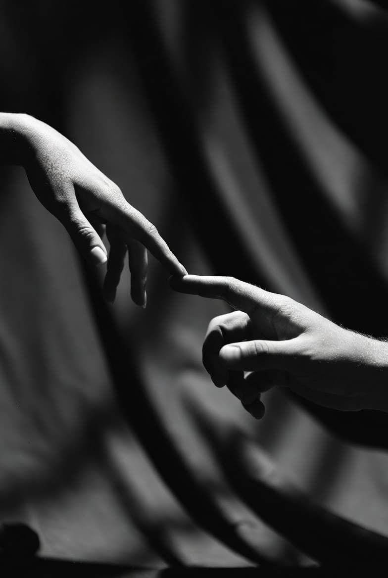 Hands reaching out, representing connection and meaning